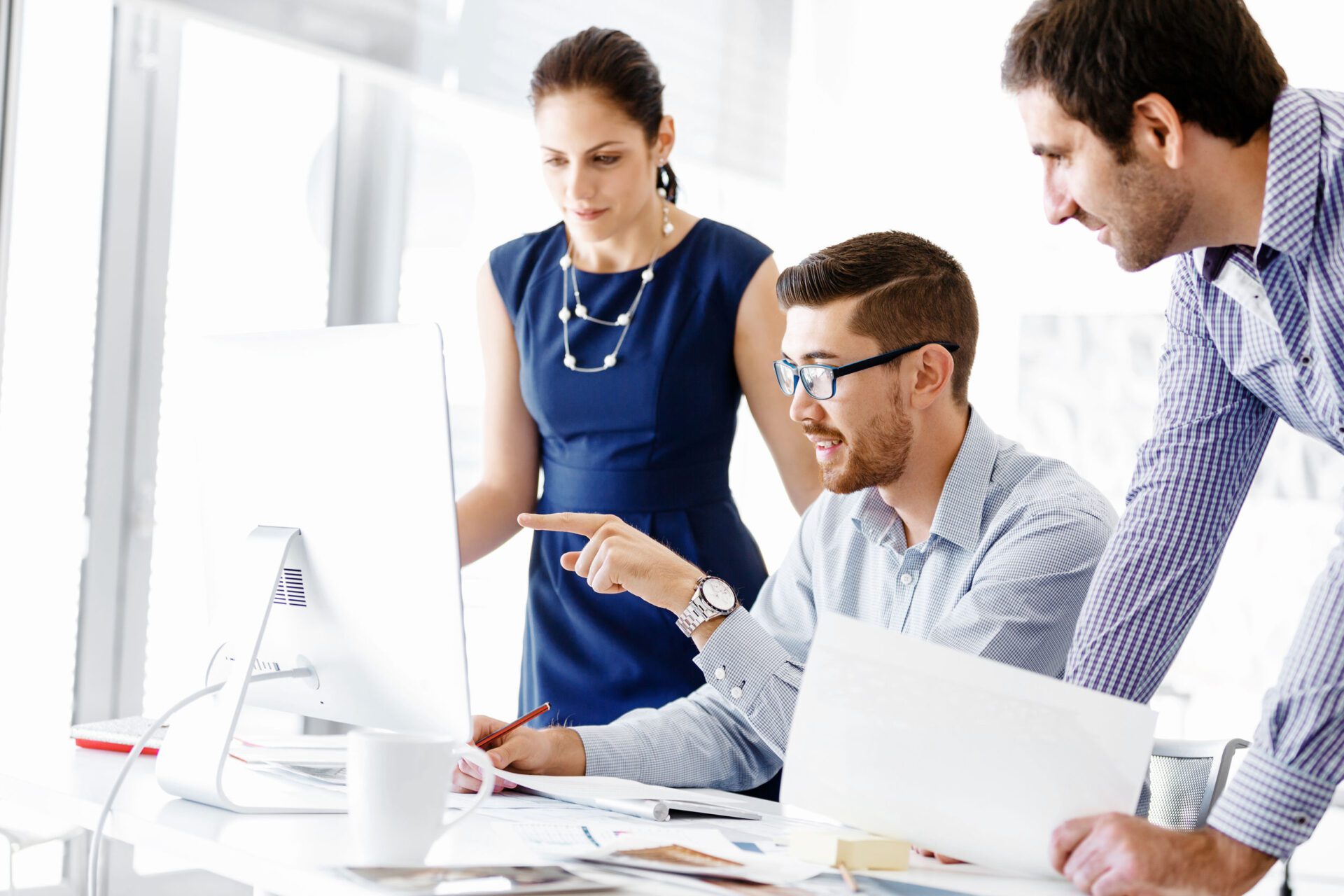 Business people in modern office Information & Resources